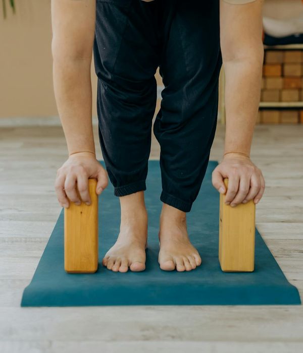 Person doing a yoga pose that demonstrates strength and flexibility.